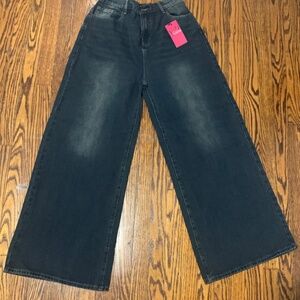 Washed grungy dark blue wide leg jeans